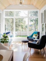 Traditionally, a bump out like this is used for a table, but we wanted to make a cosy sitting space where you can enjoy the view to the backyard and be just outside of the main living space. The ceiling is accented here in natural wood to draw interest and make the space warmer. 