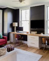 “The first floor has a separate home office were we flipped the exterior color palette by painting the walls black and the windows white,” says Hawthorn Builders.