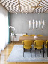 Dining Room, Pendant Lighting, Table, Chair, Light Hardwood Floor, and Track Lighting  Photo 10 of 43 in Chunky Finishes Combine With Curves in This Easter-Egg Colored Apartment by MUZA