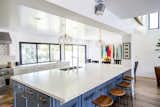 Large kitchen island with accordion window and door