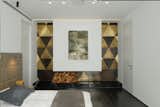 The master Suite with the brass triangle wall