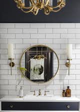 We wanted to create a striking bathroom even with intimidating colors such as whites and brass toned colors