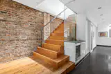 Staircase to rooftop - Glass wall by staircase replaced prior wooden cabinet system