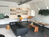 "Front room" transformed into office, living and eating space.  Particularly good when friends and family visits.  (Renovations included white brick wall, live planter, new book shelves, white paint and hanging fireplace (lower left corner).