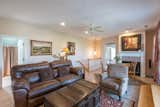 Upstairs seating area with TV and access to the large covered porch w/ceiling fans