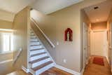 Steps down to the garage and up to three additional bedrooms