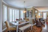 Custom made table and benches with comfortable side chairs in the eating nook