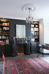 This is my office. Black is used as a common thread throughout the house while it is used here in a big expanse to a dramatic effect.