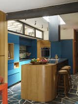 Kitchen cabinets in shades of blue, made to order. black concrete countertops. (vertical photo)