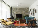 living room - on the wall there is a photo panel of Manchego, the owner's horse. On the floor, rug in earth tones
designed by the architect  Photo 7 of 54 in chalet E.14 by claudia haguiara