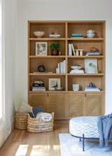 Living Room, Shelves, Bookcase, Ottomans, Storage, and Medium Hardwood Floor  Photo 9 of 13 in Lake Oswego Modern Home by Casework Interior Design