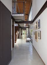 Hallway, Concrete Floor, and Medium Hardwood Floor  Photo 3 of 22 in Conde D'eu House by Estúdio Penha
