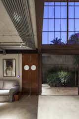 Living Room, Ceiling Lighting, Sofa, Concrete Floor, and Lamps  Photo 8 of 22 in Conde D'eu House by Estúdio Penha