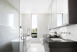 The bathrooms include high-quality materials and finishes such as quartz countertops, tiled walls, floating under-lit vanities and freestanding tubs. 