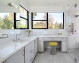 Master Bathroom with custom metal framed vanity and marble floor