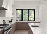 Kitchen - custom stainless hood, panel ready dishwashers, dolomite backsplash, Statuary Bella honed marble island counter