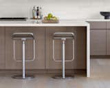 Kitchen - touch latch cabinets and marble waterfall island