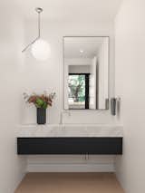Powder Room - marble counter, two hole faucet, concealed drawer in floating vanity