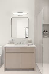 Guest Bathroom with marble counter, rift oak vanity, and curb less shower with channel set glass
