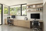 Home Office with two workspaces, board formed concrete wall, floating shelves