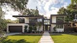 Exterior Entry - metal and composite siding, board formed concrete wall, pivot door