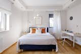 Bedroom, Bed, and Medium Hardwood Floor Teen bedroom.  Photo 13 of 19 in Eos Urban Villa by 3NK Engineers & Architects