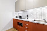 Kitchen, Colorful Cabinet, Laminate Counter, and Subway Tile Backsplashe Kitchen  Photo 6 of 16 in Small eclectic apartment in Koukaki, Athens by 3NK Engineers & Architects