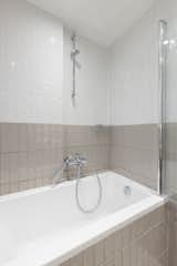 Bath Room, Soaking Tub, Subway Tile Wall, and Ceramic Tile Wall Bathroom  Photo 12 of 16 in Small eclectic apartment in Koukaki, Athens by 3NK Engineers & Architects