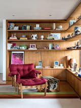 Brazilian designer Sergio Rodrigues’s armchair in the reading corner.