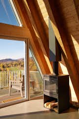 Wood stove next to beetle-kill pine rafters