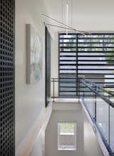 Staircase, Metal Railing, and Wood Tread  Photo 14 of 26 in INDIANA STREET HOUSE by Studio 804 by DAVID SAIN