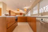 cabinets were made to match original teak built-ins in dining room