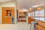 renovated kitchen and beverage station compliment vintage dining room cabinets