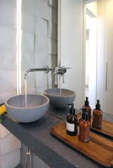 Bath Room, Wall Lighting, Porcelain Tile Floor, One Piece Toilet, Vessel Sink, Stone Counter, Ceiling Lighting, Recessed Lighting, and Porcelain Tile Wall WC detail  Photo 11 of 13 in The Float House by ss.mm design