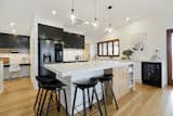Black, white and timber kitchen with feature pendants. Interior Design by Bella Vie Interiors