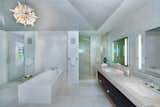 Each bathroom speaks luxury with high-ceilings and intricate coastal modern accents.