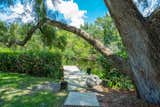 Outdoor, Trees, Walkways, and Back Yard  Photo 4 of 35 in The Banyan Beach House Asks a Breezy $3.6 Million by Premier Sotheby's International Realty