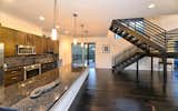 Kitchen and Staircase to Third Level  Photo 14 of 32 in Modern Architecture On 20 Acres by Reid Gerletti
