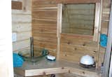 Vessel sink and storage chest behind the mirror