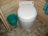 Space age toilet.  Works like a diaper genie.  Runs on batteries so you never have smells when power is not connected.