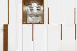 cabinetry and curio display with cherry accent cut outs