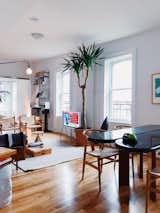Living Room — Dining Table (Lichen/Williamsburg), Hans Wegner 'Wishbone' Dining Chairs, West Elm leather couch, Prouve Potence lamp, Bang&Olufsen A9 Speaker, Arne Norell 'Safari' Chairs, Table by BluDot, vintage gym box from Berlin, Serif TV by Samsung 
