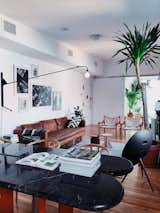 Living Room — Dining Table (Lichen/Williamsburg), Hans Wegner 'Wishbone' Dining Chairs, West Elm leather couch, Prouve Potence lamp, Bang&Olufsen A9 Speaker, Arne Norell 'Safari' Chairs, Tables by BluDot and hem. 