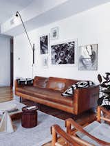 Living Room — West Elm leather couch, Prouve Potence lamp, Bang&Olufsen A9 Speaker, Arne Norell 'Safari' Chairs, Tables by BluDot and  hem, vintage gym box from Berlin, IKEA pillow, MoMA Design Store throw, rug by hem, Art by Maximilian Hoch (bottom left) - Photography by Nick Laham and flea market finds.  