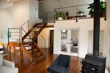 Stairs leading to a guest bed and reading nook.  Behind the french doors is our home office.