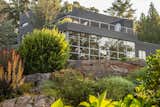 The unique form of this steel framed house emerges from a combination of extensive and mature specimen landscape and rock outcroppings. Enjoy expansive views of Long Island Sound through the custom windows with low E tinted window glass which protects your furnishings and art.