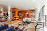 Enjoy a one-of-a-kind 4 sided gas fireplace, Anegre and Mahogany millwork throughout this versatile and open floor plan.