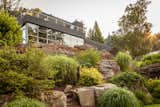 The unique form of this steel framed house emerges from a combination of extensive and mature specimen landscape and rock outcroppings. Enjoy expansive views of Long Island Sound through the custom windows with low E tinted window glass which protects your furnishings and art.