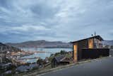 Equal parts home and office, the studio retreat boasts expansive views of Lyttelton Harbor.