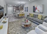 Plush living spaces were crafted with features such as luxury plank flooring, nine-foot ceilings, and an in-residence washer & dryer in each home. Contemporary kitchens are functional and attractive, with details such as white quartz countertops, subway tile backsplash, custom espresso cabinetry, chrome Moen® fixtures, a gas range, and stainless-steel appliances.